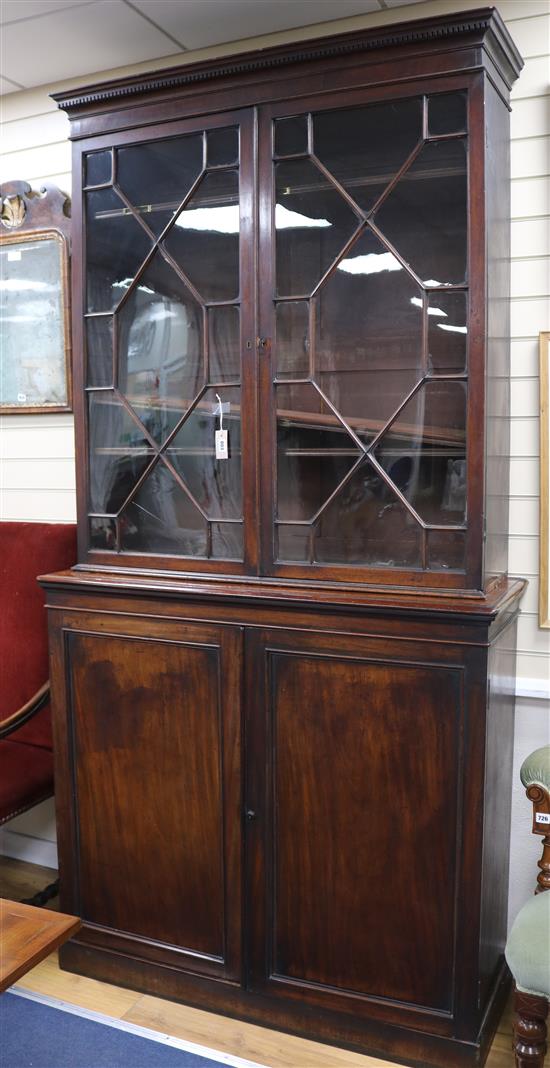 A Georgian glazed mahogany bookcase, (the two parts associated), H.240cm